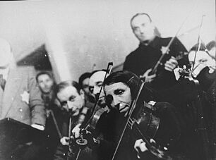 Violinists perform in the Kovno ghetto orchestra